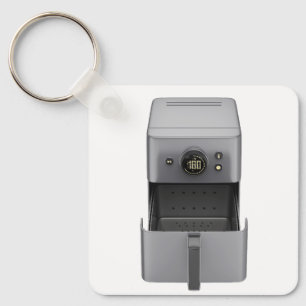 Front view of an open, empty air fryer keychain