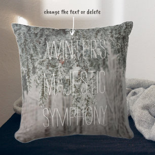 Frosted branches and a snow-covered forest throw pillow