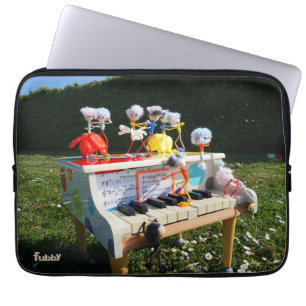 Fubbies on the piano making and dancing music. laptop sleeve