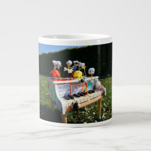 Fubbies on the piano making and dancing music. large coffee mug