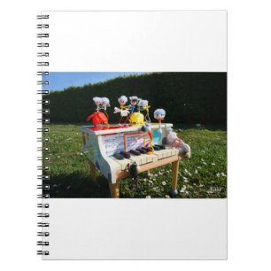 Fubbies on the piano making and dancing music. notebook