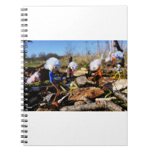 Fubby figures cooperation on a woodworking plane notebook