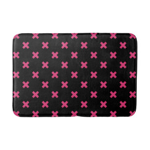 Fuchsia cross stitches on black bath mat