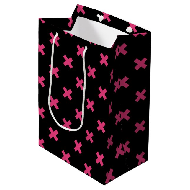 Fuchsia cross stitches on black medium gift bag (Front Angled)
