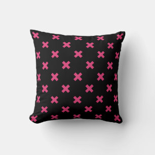 Fuchsia cross stitches on black throw pillow