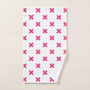 Fuchsia cross stitches on white hand towel