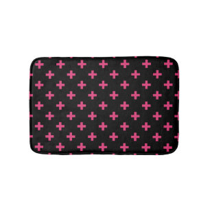 Fuchsia polka crosses on black bath mat