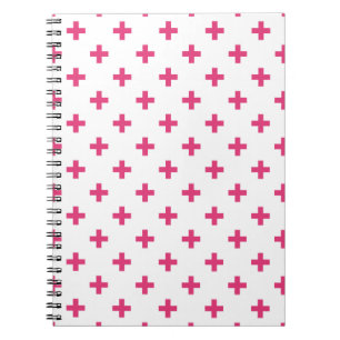 Fuchsia polka crosses on white notebook