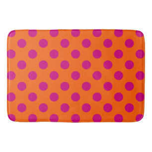 Fuchsia polka dots on orange bath mat