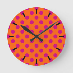 Fuchsia polka dots on orange round clock
