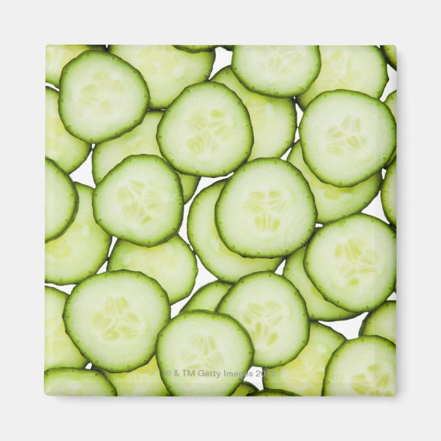 Full frame of sliced cucumber, on white magnet (Front)