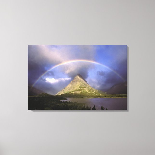 Full rainbow and stormy sky over Grinnell Canvas Print (Front)
