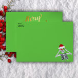Fun Christmas Skeleton Santa Hat Ornaments Gold  Envelope<br><div class="desc">This envelope is green with a fun Christmas skeleton on the front in corner wearing a red Santa Hat holding up to shiny ornaments to his eyes.  Merry Christmas text in bright gold is on the back flap and the inside is dark green with tiny gold flecks.</div>