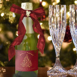 Fun Gold Stars Christmas Tree on Red Mini Holiday Sparkling Wine Label<br><div class="desc">These cute mini holiday sparkling wine bottle labels are perfect for anyone who wants to give the gift of bubbly this holiday season. They feature a festive design with a Christmas tree made of golden sparkles or stars on a marbled crimson red background. The caption reads "Merry Christmas" with room...</div>
