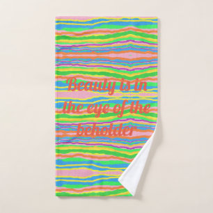 Fun logo on an art inspired striped pattern towel