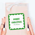 Fun Retro Wavy Green Trendy Custom Chic Christmas Square Sticker<br><div class="desc">Add a touch of playful nostalgia to your holiday festivities with this retro-inspired Christmas sticker! The bold green and white colour palette, paired with a chic scalloped border, creates a classic yet joyful design that catches the eye. Personalize it with your family name for a unique holiday accent, perfect for...</div>
