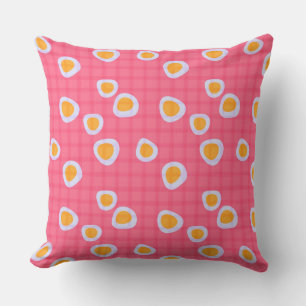 Fun spots on a coral pink checkered background outdoor pillow