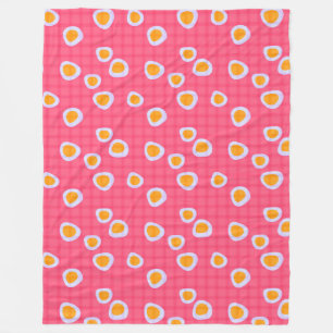 Fun spots on a coral pink chequered background fleece blanket