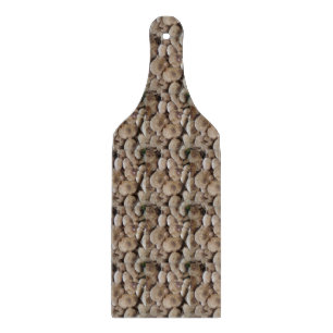 fun vegatable picture of fresh button mushrooms cutting board