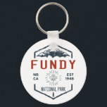 Fundy National Park Canada Vintage Distressed Keychain<br><div class="desc">Fundy National Park Distressed Badge with unique park themed maple leaf design. The Park showcases a rugged coastline which rises up to the Canadian Highlands,  the highest tides in the world and more than 25 waterfalls.</div>
