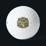 Funny 60th Birthday Golf Balls<br><div class="desc">Celebrate turning 60 with a laugh on the golf course! These funny 60th birthday golf balls feature a goofy “Still Swinging After All These Years” design with 60 printed right on the ball. Perfect for golfers who know that age is just a number—especially when the swing is still going strong....</div>