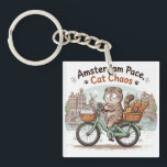 Funny Amsterdam Cat Keychain<br><div class="desc">Bring a touch of playful chaos to your wardrobe with this adorable Amsterdam-inspired cat design! Featuring a chubby kawaii cat riding a bicycle through a charming Dutch city scene,  this shirt perfectly blends humor,  travel vibes,  and cute aesthetics,  Perfect as a gift for cat lovers.</div>