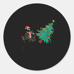 Funny Black Cat Gift Pushing Christmas Tree Over C Classic Round Sticker