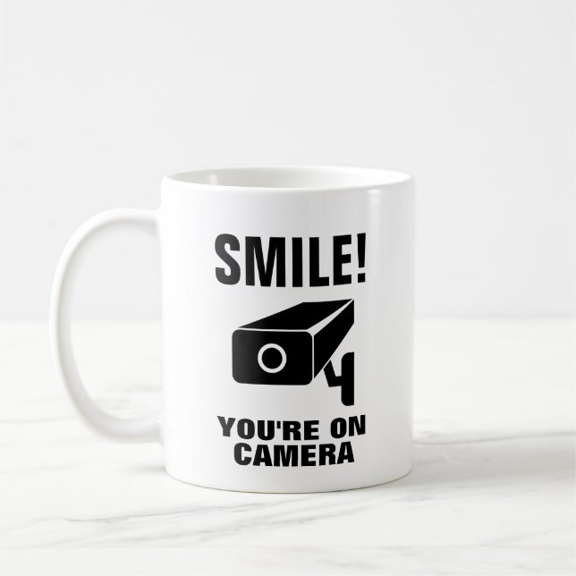 Funny coffee mug - Smile you're on camera (Left)