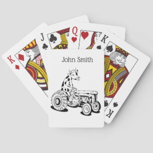 Funny cow on a tractor playing cards