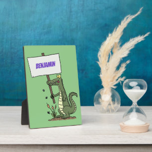 Funny crocodile aligator with sign cartoon plaque