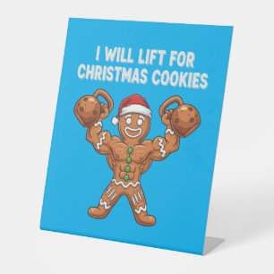 Funny Gingerbread Man Lifting Christmas Cookies Pedestal Sign