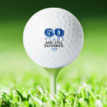 Funny Golf Balls 60th Birthday Party Monogrammed<br><div class="desc">Your golfer who is turning sixty will get a laugh from these personalized Golf Balls. Features a design with text that reads "60 Years And Still Swinging". (You can change the number to any year.) Personalize with monogrammed initials, name or date. A perfect for gift or party favour for a...</div>