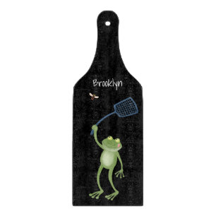 Funny green frog swatting fly cartoon cutting board