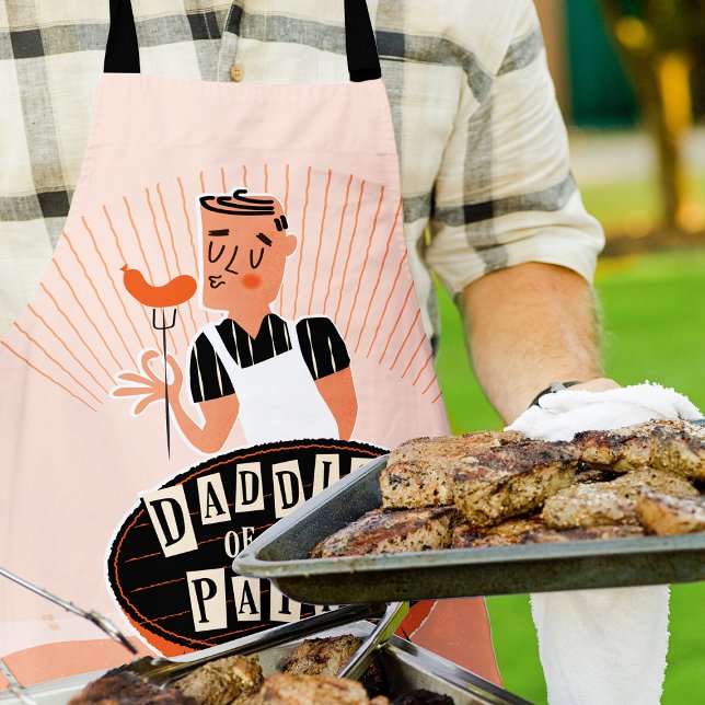 Funny Grill Apron for Dad, Daddio of the Patio (Man outside wearing a "Daddio of the patio apron" while grilling and holding a large platter of meat)