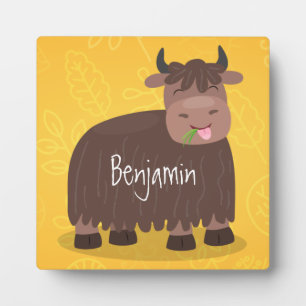 Funny happy yak eating grass cartoon illustration plaque