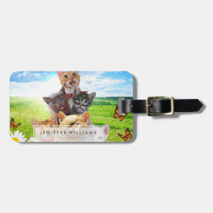 Funny kittens in green field.                      luggage tag