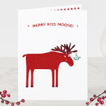 Funny Moose Holiday Card<br><div class="desc">Merry Kiss Moose funny red and white Christmas holiday card featuring a whimsical moose or elk with a bunch of mistletoe tied to his antler, hoping for a cheeky kiss.
Change or remove the message and add your family name to the greeting inside to customize.</div>