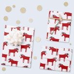 Funny Moose Holiday Red and White Wrapping Paper Sheet<br><div class="desc">Merry Kiss Moose funny red and white Christmas holiday design featuring a whimsical moose or elk with a bunch of mistletoe tied to his antler,  hoping for a cheeky kiss.
Perfect for animal lovers.</div>