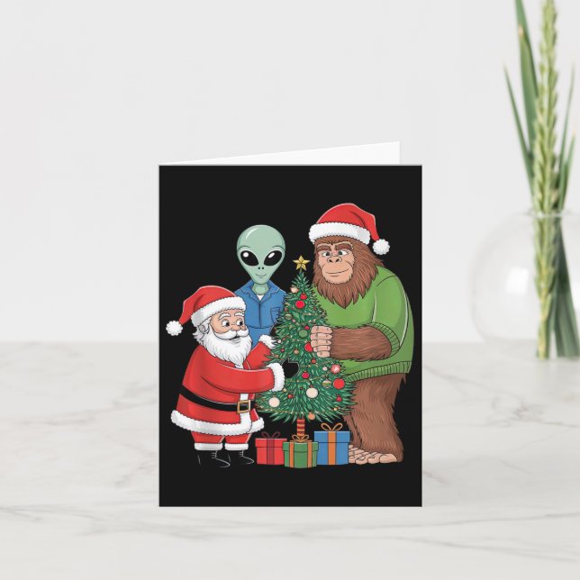 Funny Santa Bigfoot Alien Decorating Christmas Tre Card (Front)