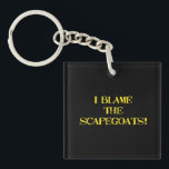 Funny Scapegoat Quote A Bold Statement on Blame Keychain<br><div class="desc">This striking image delivers a punchy message—"I BLAME THE SCAPEGOATS!"—in distressed yellow stencil text against a stark black background. It's a satirical take on the human tendency to deflect responsibility,  making it perfect for social commentary,  humor,  or protest-themed content. #BlameCulture #SatireArt #ScapegoatStatement #BoldTypography</div>
