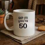 Funny Sip It You're Fifty 50th Birthday Coffee Mug<br><div class="desc">Sip Happens—You're 50! Add a splash of humour to their morning brew with this bold and cheeky birthday mug! Featuring the quote “Sip It! You're 50” in a clean black-letter design, it’s the perfect mix of sass and celebration. The age can be customized, making it great for any milestone—30, 40,...</div>