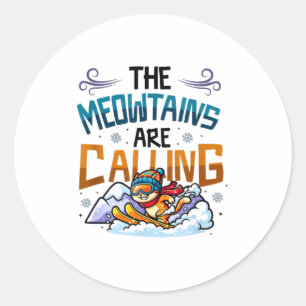 Funny skiing cat the meowtains are calling classic round sticker