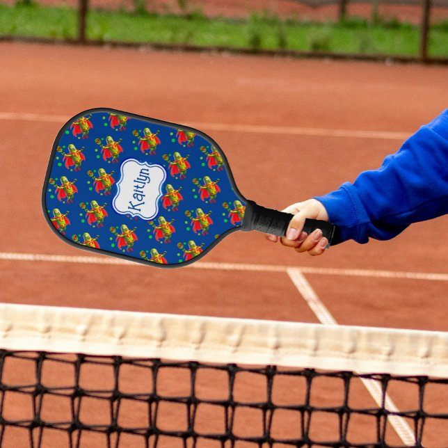 Funny SuperPickleman on Blue Personalized Pickleball Paddle (Fun Pickle People fly through the sky, their rackets close at hand!)