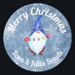 Funny Watercolor Christmas Gnome Classic Round Sticker<br><div class="desc">Be unique and send Holiday Greetings with Gnomes! This design features watercolor snowflakes and a cute gnome holding Christmas lights. Add your message and make someone smile when they receive this funky sticker with your holiday greeting or gift. Part of our "Holiday Gnomes' collection.</div>