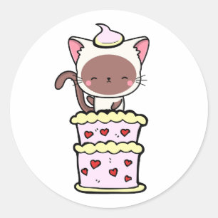 Funny white cat jumping out of a cake classic round sticker