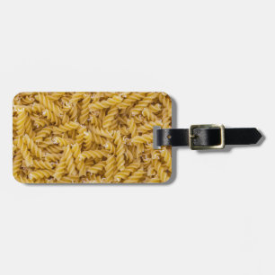 Fusilli pasta macro as background structure luggage tag