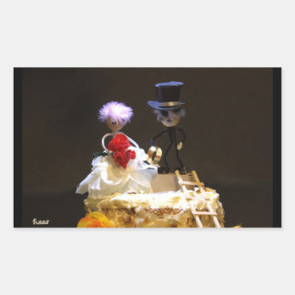 Fuzzy bride and groom on cake. sticker