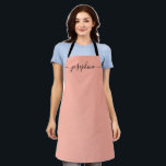 Fuzzy Peach Trendy Elegant script Name Apron<br><div class="desc">She'll love a personalized apron as she bakes those goodies,  cooks delicious dishes or work with her plants. A perfect gift to encourage her talents. Black script for the name with long-tail embellishments. Fuzzy Peach colour.</div>