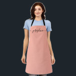 Fuzzy Peach Trendy Elegant script Name Apron<br><div class="desc">She'll love a personalized apron as she bakes those goodies,  cooks delicious dishes or work with her plants. A perfect gift to encourage her talents. Black script for the name with long-tail embellishments. Fuzzy Peach colour.</div>