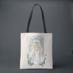Galadriel Light of Valinor Graphic Tote Bag<br><div class="desc">Step into the radiant grace of Middle-Earth™ with this exquisite Lord of the Rings™ design inspired by Galadriel™. Illustrated in an elegant, Art Nouveau–inspired style, she stands poised and luminous, holding a phial of the Light of Valinor with serene strength and quiet authority. Flowing golden hair, delicate Elven adornments, and...</div>